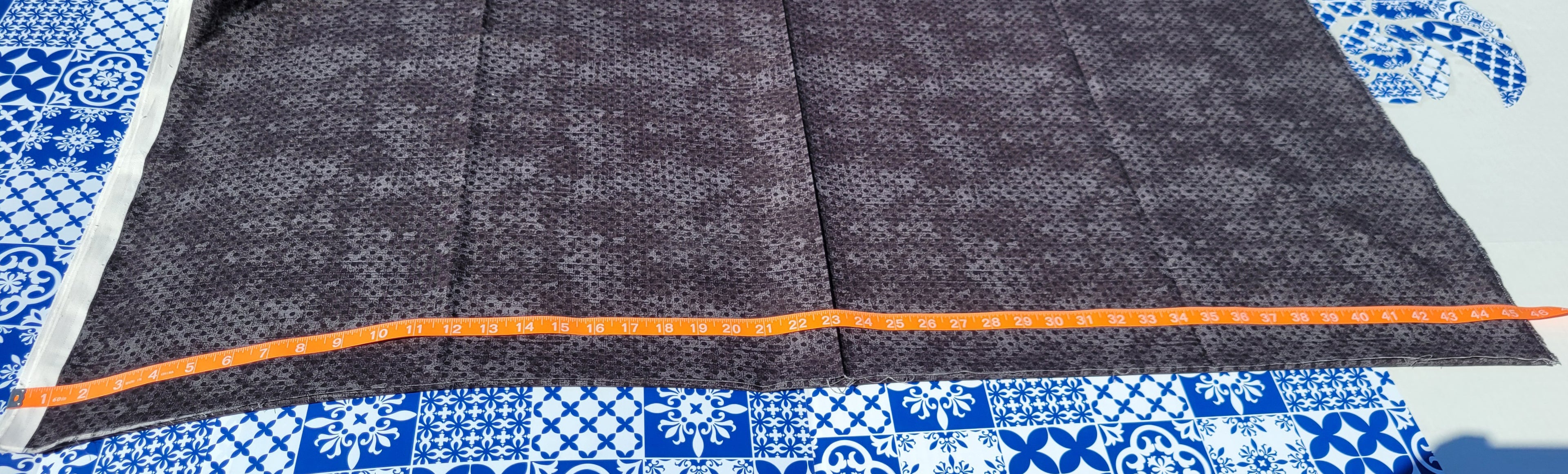 Black polka dot pattern on a mixture of Black and Charcoal Gray Fabric